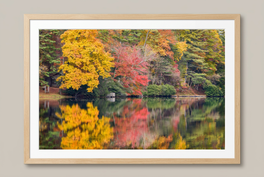 Autumn cabin and lake photograph with wood frame and white mat