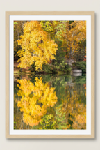 Autumn lake and wooden deck photograph with wood frame and white mat